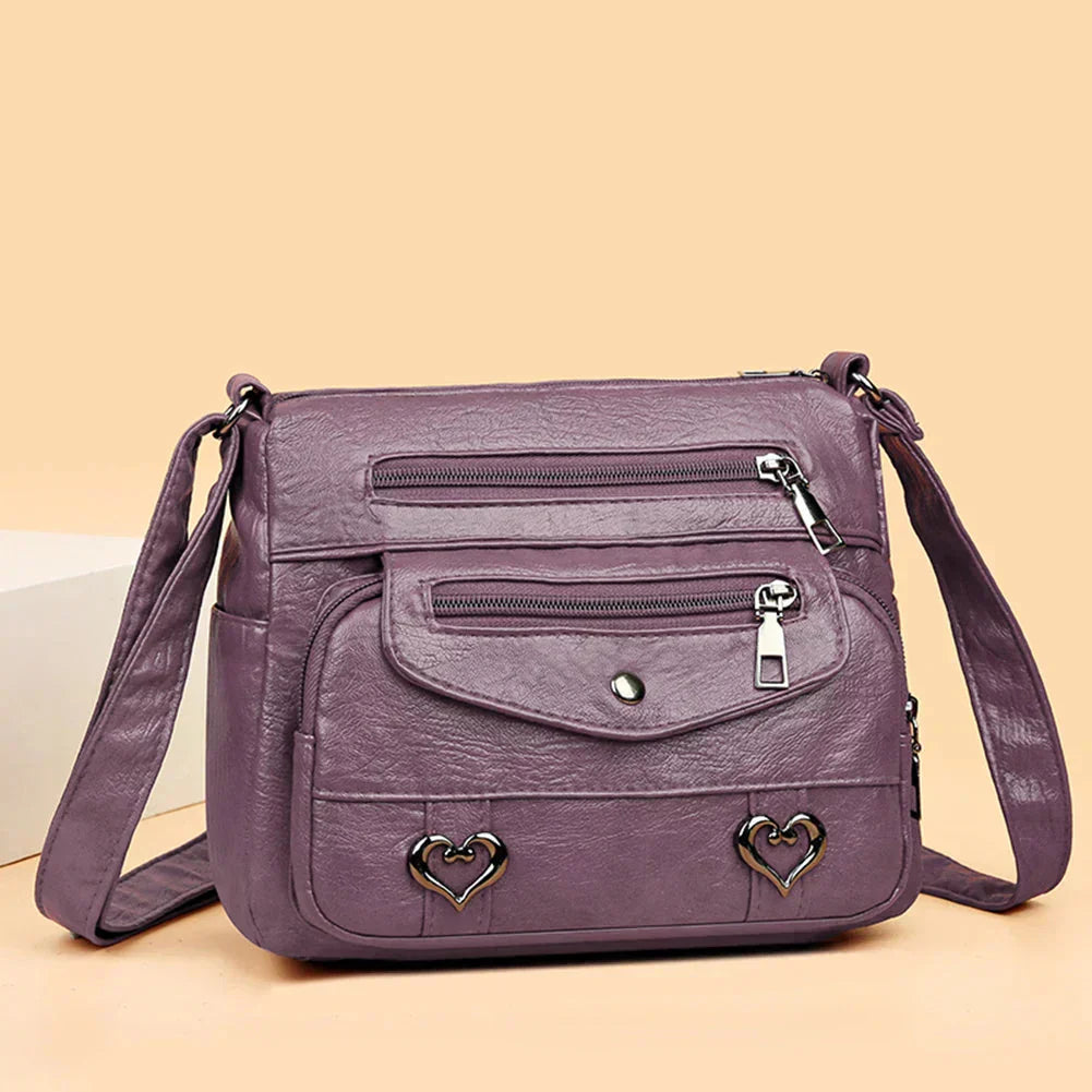 Lux | Bolso cruzado con acento de corazón a la moda